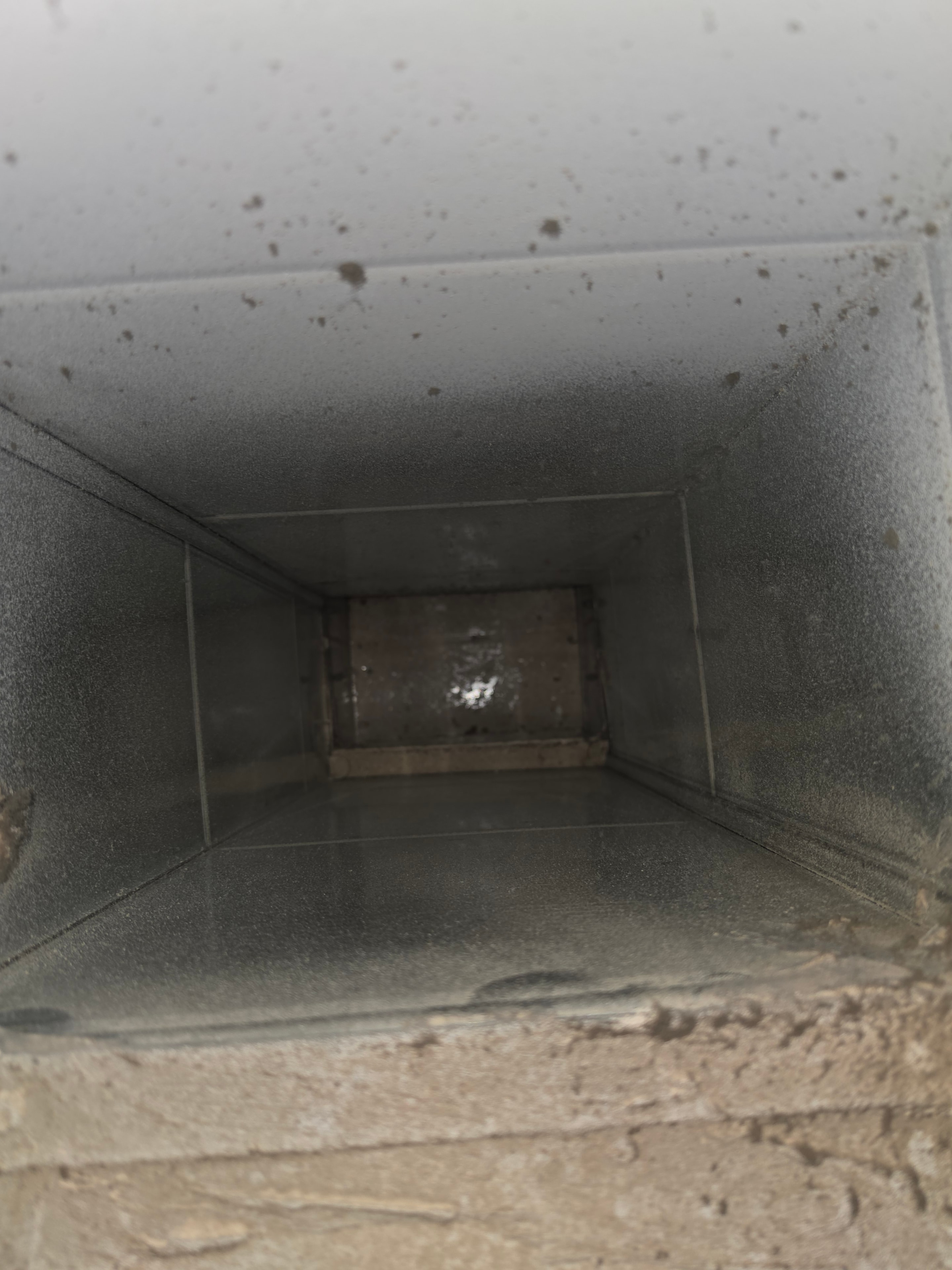 Inside view of duct trunk coated in debris and buildup — Princeton NJ before cleaning